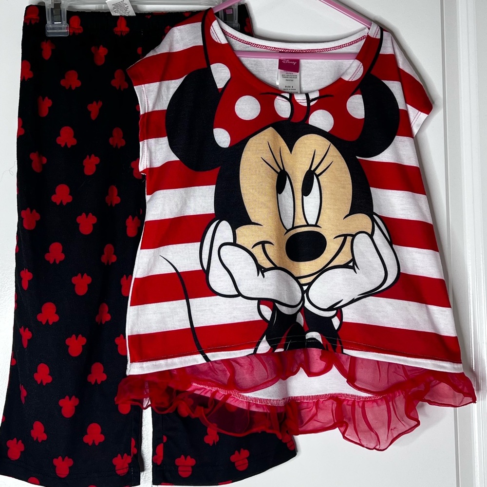 Size 8 Minnie Mouse Pajama set. 100% polyester, very soft and comfy material.